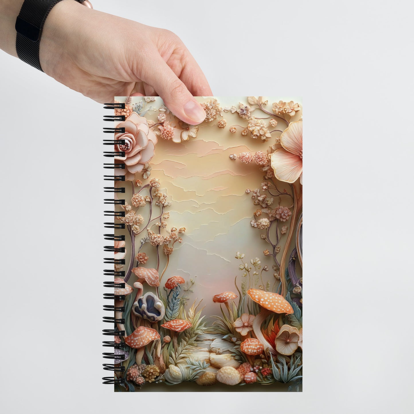 Handheld view of a notebook with a magical mushroom border