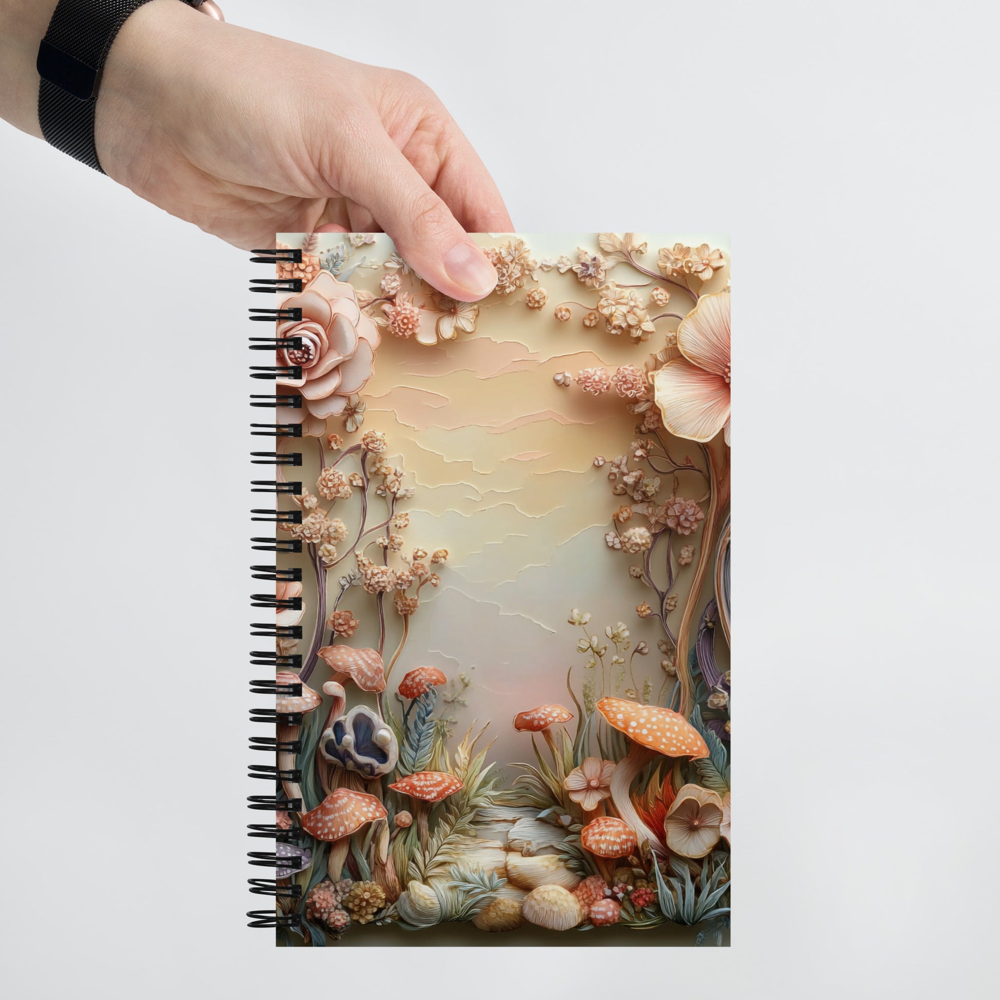 Handheld view of a notebook with a magical mushroom border